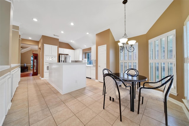 22710 Sierra Lake Ct, Katy, TX 77494 - dining space featuring vaulted ceiling, a chandelier, light tile patterned floors, and recessed lighting