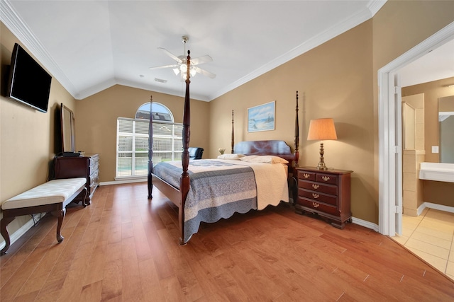 22710 Sierra Lake Ct, Katy, TX 77494 - bedroom featuring light wood-style floors, ceiling fan, ornamental molding, ensuite bath, and vaulted ceiling