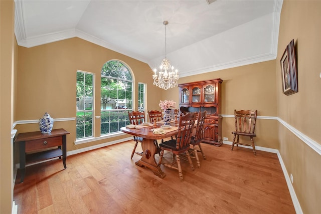 22710 Sierra Lake Ct, Katy, TX 77494 - dining area with light wood-style floors, a chandelier, vaulted ceiling, and crown molding