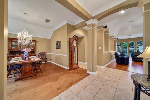 22710 Sierra Lake Ct, Katy, TX 77494 - dining space with ornamental molding, ornate columns, light wood-style flooring, a chandelier, and recessed lighting