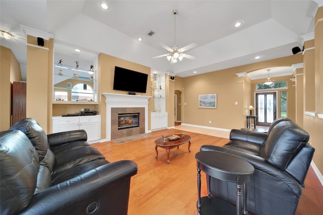 22710 Sierra Lake Ct, Katy, TX 77494 - living area with light wood finished floors, a ceiling fan, a fireplace, and recessed lighting
