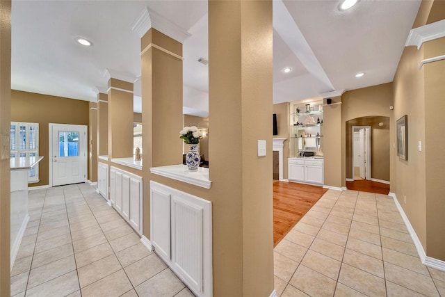 22710 Sierra Lake Ct, Katy, TX 77494 - corridor featuring light tile patterned floors, recessed lighting, ornamental molding, and arched walkways