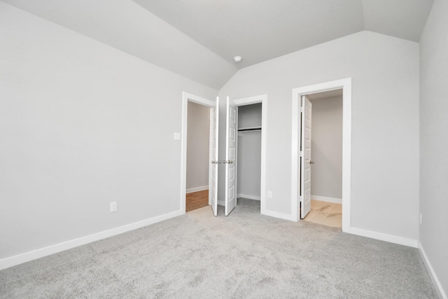 11138 Gardenia Creek Dr, Houston, TX 77044 - unfurnished bedroom featuring lofted ceiling, carpet, and a closet
