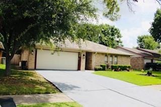 5923 Pine Needle Ln, Pasadena, TX 77505 - view of front of house with driveway, a garage, and a front yard