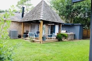 5923 Pine Needle Ln, Pasadena, TX 77505 - back of property with a wooden deck and a gazebo