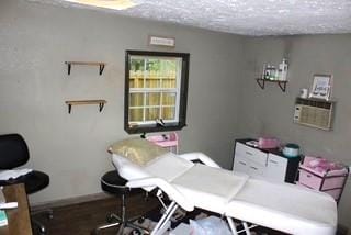 5923 Pine Needle Ln, Pasadena, TX 77505 - office space with a textured ceiling and wood finished floors