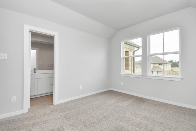 12030 Maple Oak Dr, Houston, TX 77066 - unfurnished bedroom with carpet flooring, vaulted ceiling, and ensuite bath