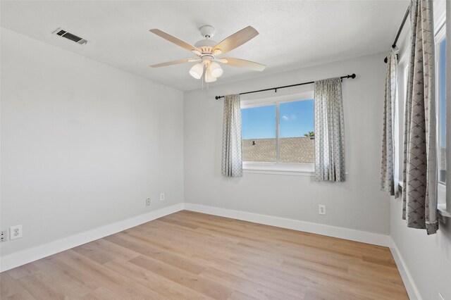 4034 Reeves Dr, Galveston, TX 77554 - spare room with wood finished floors and a ceiling fan