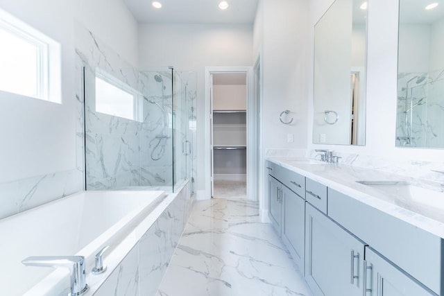 739 Bringhurst St, Houston, TX 77020 - full bath with a marble finish shower, double vanity, a bath, marble tiled floors, and recessed lighting