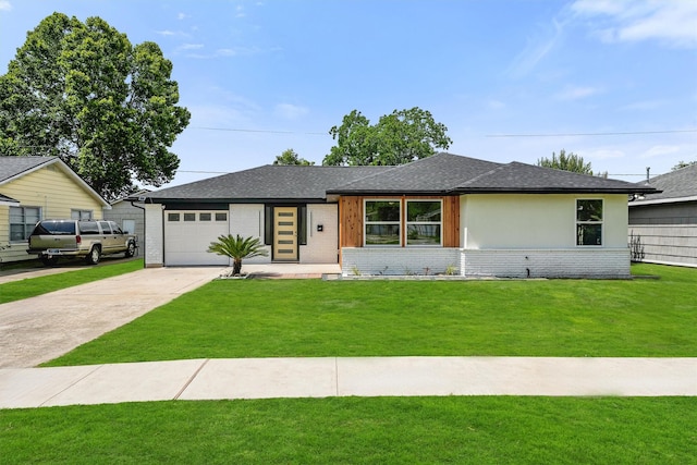 3303 Dartmouth Dr, Pasadena, TX 77503 - view of front of property featuring concrete driveway, a garage, a front lawn, brick siding, and roof with shingles