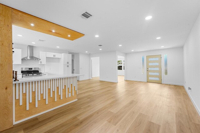 3303 Dartmouth Dr, Pasadena, TX 77503 - unfurnished living room featuring recessed lighting and light wood-style floors