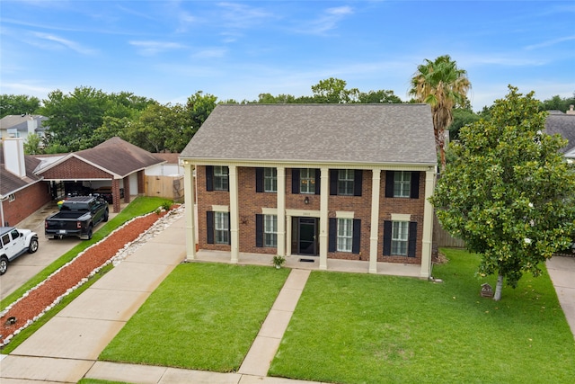 2802 Sandpebble Dr, Seabrook, TX 77586 - neoclassical / greek revival house featuring brick siding and concrete driveway