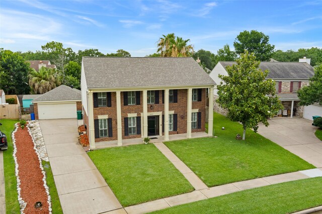 2802 Sandpebble Dr, Seabrook, TX 77586 - greek revival inspired property featuring a garage, brick siding, and roof with shingles
