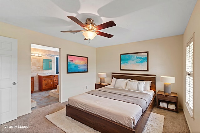 2802 Sandpebble Dr, Seabrook, TX 77586 - bedroom with multiple windows, light colored carpet, and ensuite bathroom