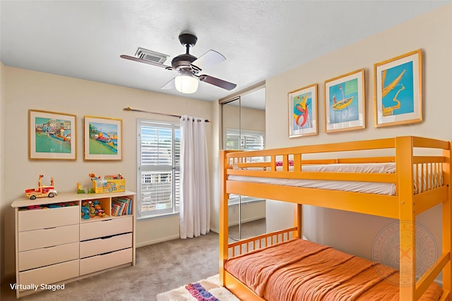 2802 Sandpebble Dr, Seabrook, TX 77586 - bedroom featuring light carpet, a closet, and a ceiling fan