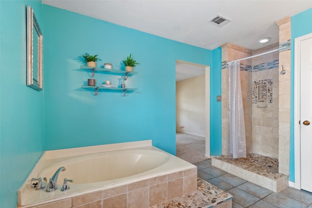 2802 Sandpebble Dr, Seabrook, TX 77586 - bathroom with a garden tub, a shower stall, and tile patterned floors