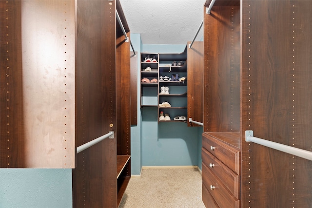2802 Sandpebble Dr, Seabrook, TX 77586 - walk in closet featuring carpet flooring