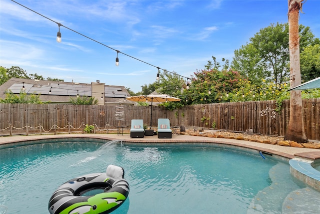 2802 Sandpebble Dr, Seabrook, TX 77586 - view of swimming pool with a fenced backyard and a pool with connected hot tub