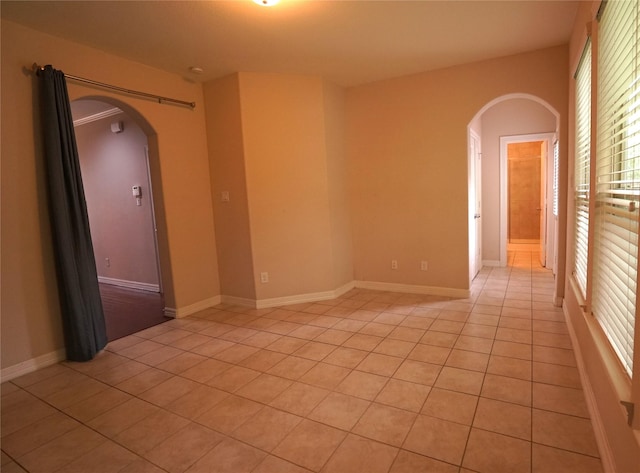 12248 Oxford Crescent Cir, Houston, TX 77082 - unfurnished room featuring arched walkways and light tile patterned floors