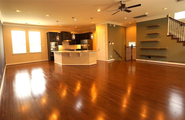 12248 Oxford Crescent Cir, Houston, TX 77082 - unfurnished living room featuring dark wood-style floors, ceiling fan, ornamental molding, recessed lighting, and stairs
