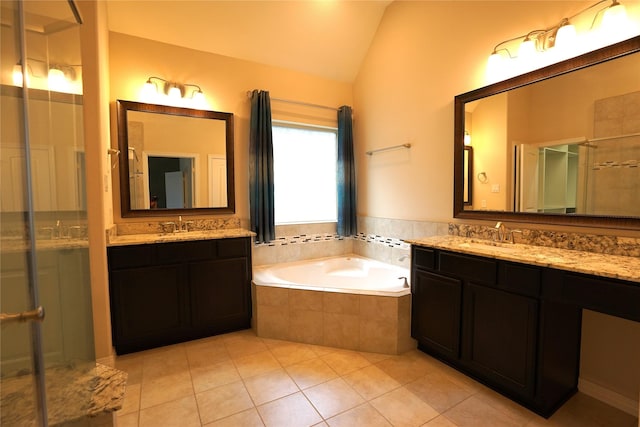 12248 Oxford Crescent Cir, Houston, TX 77082 - full bathroom with lofted ceiling, two vanities, tile patterned floors, a bath, and a shower stall