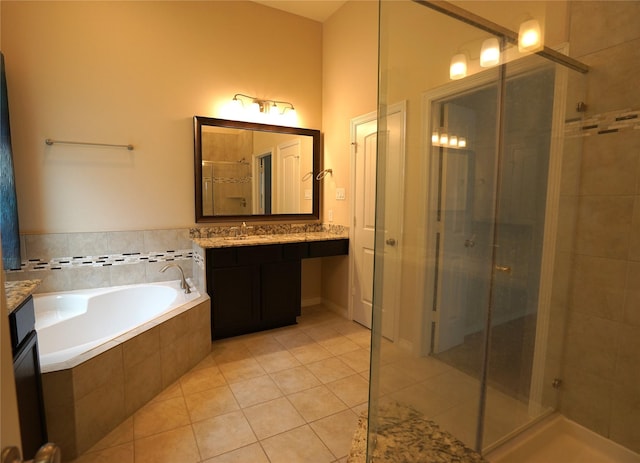 12248 Oxford Crescent Cir, Houston, TX 77082 - full bathroom featuring a stall shower, vanity, a garden tub, and tile patterned floors