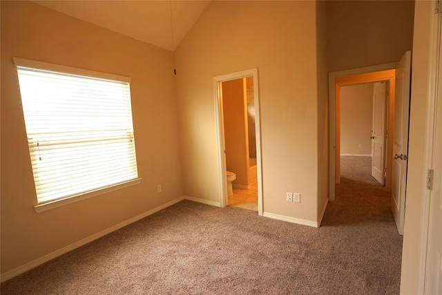 12248 Oxford Crescent Cir, Houston, TX 77082 - unfurnished bedroom with multiple windows, carpet flooring, lofted ceiling, and ensuite bathroom