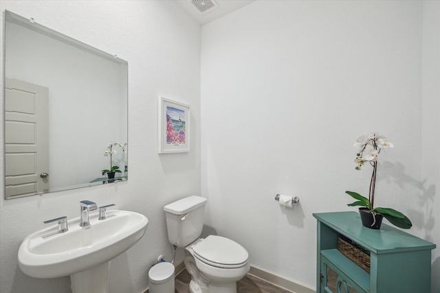 7714 Cattleman Valley Dr, Rosharon, TX 77583 - bathroom with a sink and wood finished floors