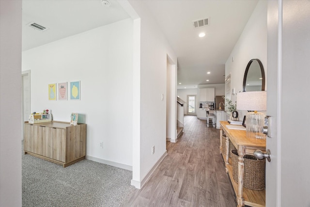 7714 Cattleman Valley Dr, Rosharon, TX 77583 - corridor with stairs, light wood-style flooring, and recessed lighting