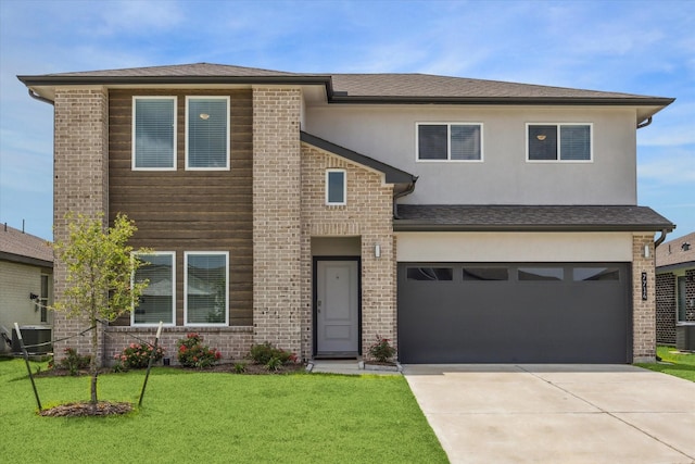 7714 Cattleman Valley Dr, Rosharon, TX 77583 - view of front of house featuring driveway, a front yard, an attached garage, and brick siding