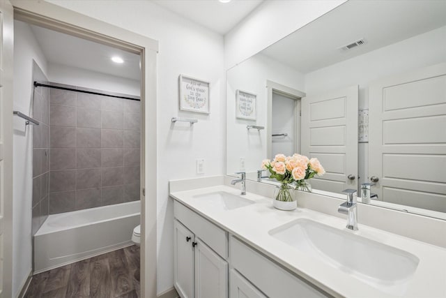 7714 Cattleman Valley Dr, Rosharon, TX 77583 - full bath with wood finished floors, double vanity, bathing tub / shower combination, and recessed lighting