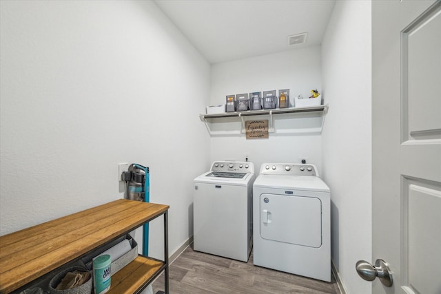 7714 Cattleman Valley Dr, Rosharon, TX 77583 - laundry room with washing machine and clothes dryer and wood finished floors