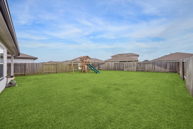 7714 Cattleman Valley Dr, Rosharon, TX 77583 - fenced backyard with a playground