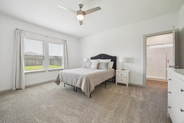 7714 Cattleman Valley Dr, Rosharon, TX 77583 - carpeted bedroom with multiple windows, ceiling fan, and ensuite bath