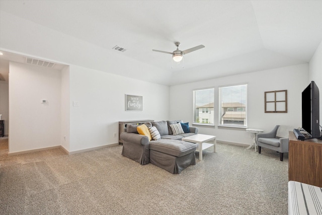 7714 Cattleman Valley Dr, Rosharon, TX 77583 - living area featuring light carpet, a ceiling fan, and a raised ceiling