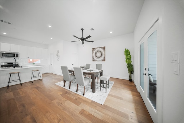 1124 Hogan St, Houston, TX 77009 - dining area featuring light wood-style floors, recessed lighting, and a ceiling fan