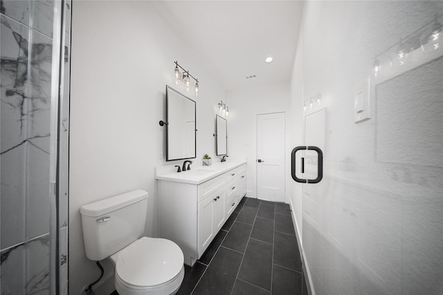 1124 Hogan St, Houston, TX 77009 - full bathroom with double vanity, a marble finish shower, and tile patterned floors