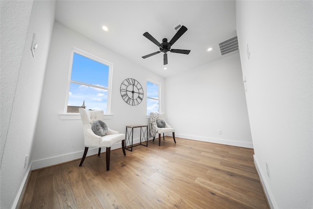 1124 Hogan St, Houston, TX 77009 - sitting room featuring ceiling fan, wood finished floors, and recessed lighting