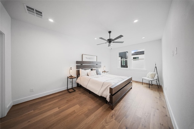 1124 Hogan St, Houston, TX 77009 - bedroom featuring wood finished floors, a ceiling fan, and recessed lighting