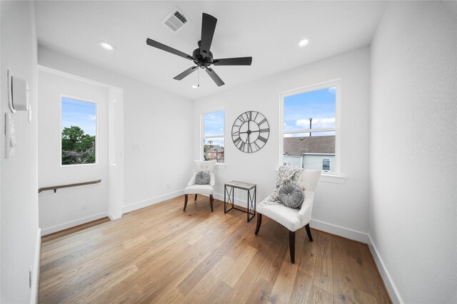1124 Hogan St, Houston, TX 77009 - living area with light wood finished floors, recessed lighting, and a ceiling fan