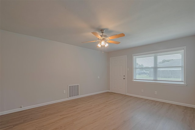 2401 33rd Ave N, Texas City, TX 77590 - unfurnished room featuring light wood-style flooring and ceiling fan