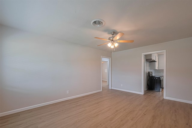2401 33rd Ave N, Texas City, TX 77590 - unfurnished room with ceiling fan and light wood-style flooring