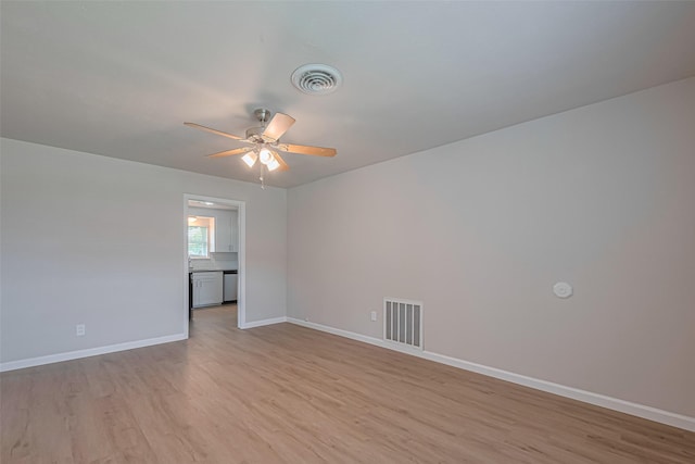 2401 33rd Ave N, Texas City, TX 77590 - unfurnished room featuring a ceiling fan and light wood-style flooring