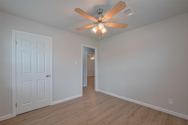 2401 33rd Ave N, Texas City, TX 77590 - unfurnished bedroom featuring light wood-type flooring and a ceiling fan