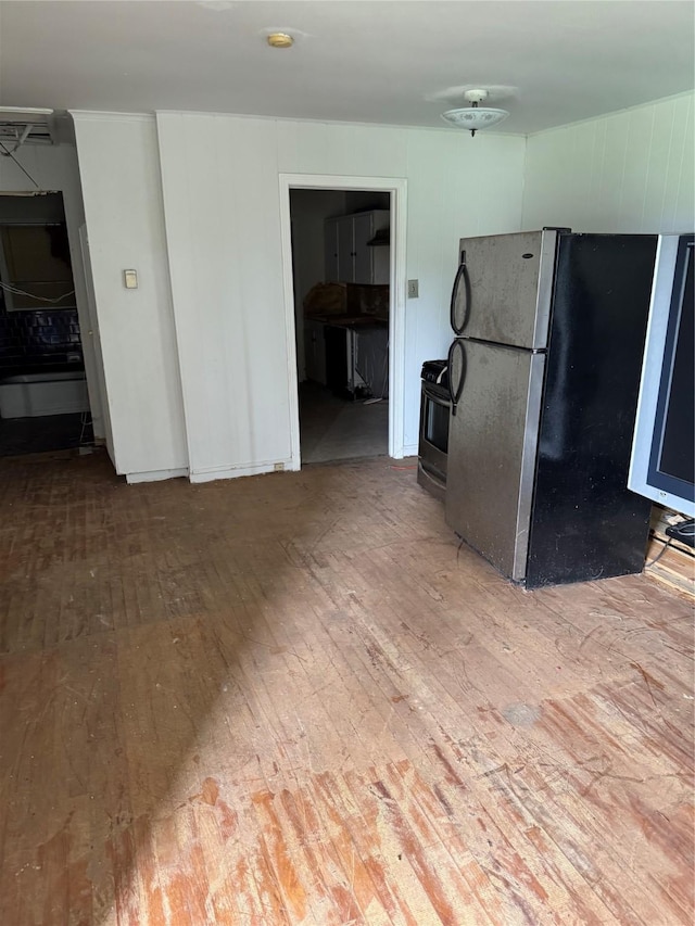 5050 Nassau Rd, Houston, TX 77021 - kitchen featuring freestanding refrigerator, range with gas cooktop, and wood-type flooring
