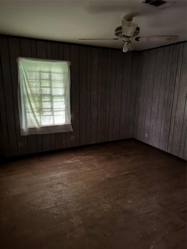 5050 Nassau Rd, Houston, TX 77021 - unfurnished room featuring ceiling fan and wood walls