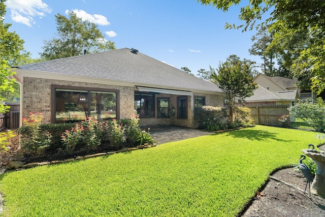 13727 Fountainview Dr, Montgomery, TX 77356 - rear view of house with a patio, a shingled roof, and brick siding