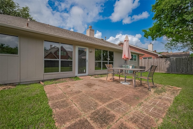 3007 Cloverdale, League City, TX 77573 - back of house with a patio area, a chimney, and outdoor dining space