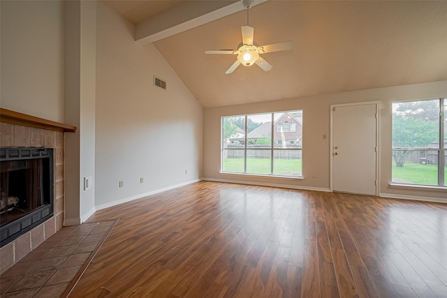 3007 Cloverdale, League City, TX 77573 - unfurnished living room featuring wood finished floors, a fireplace, beamed ceiling, ceiling fan, and high vaulted ceiling