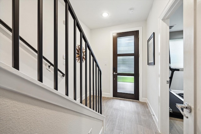 1050 Timbergrove Yards Ln, Houston, TX 77008 - foyer with wood finished floors, stairs, and recessed lighting